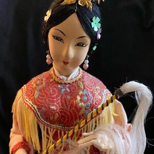 Elegant Asian Doll with Red and Gold Accents